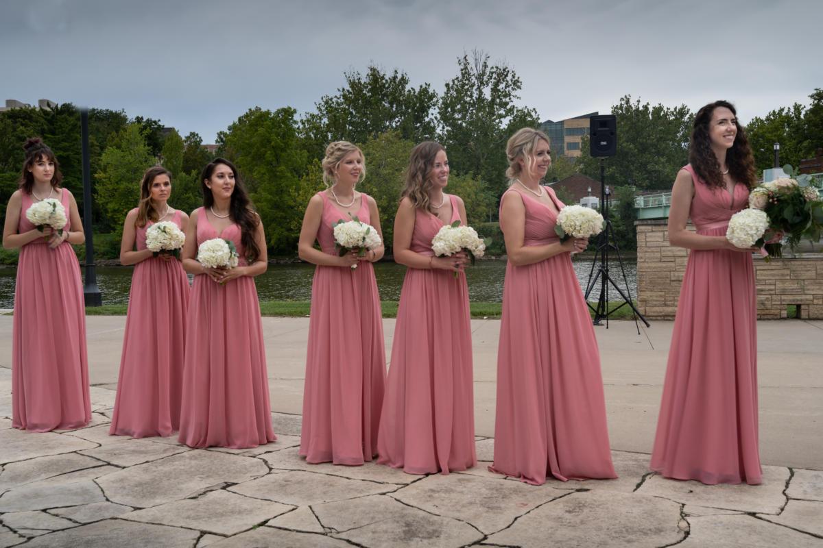 bridesmaids lined up with bouquets
