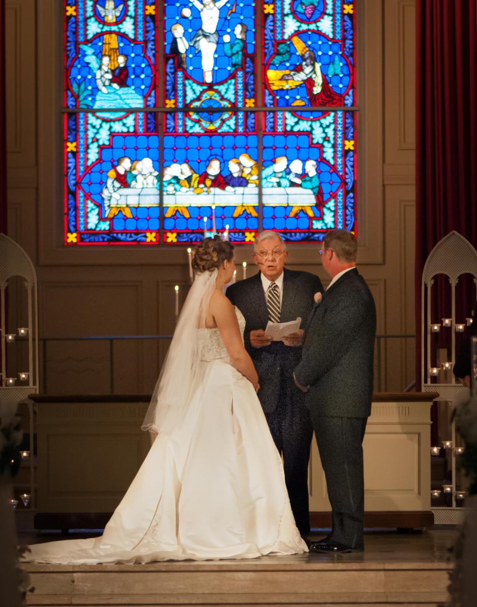 couple exchanging vows stained glass
