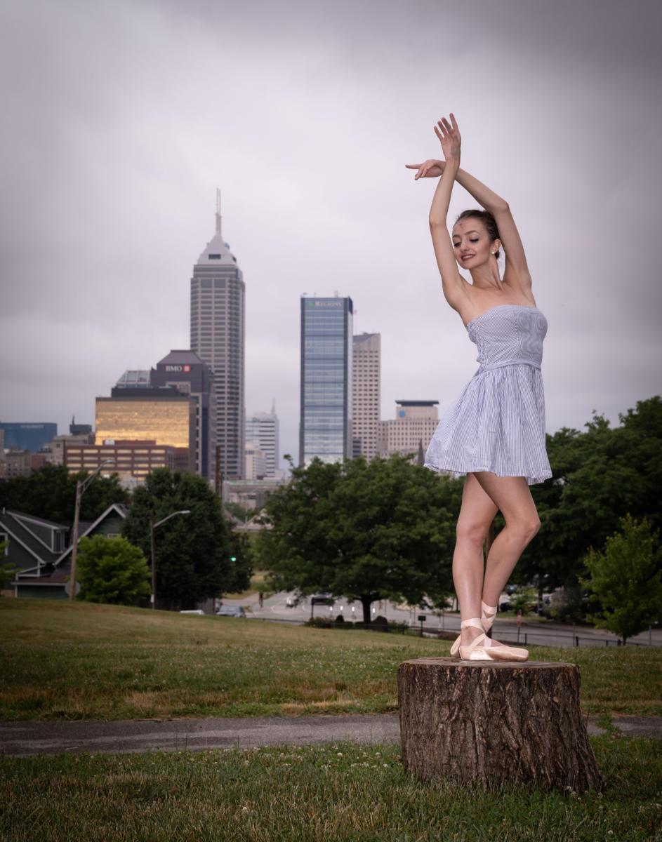 dancer against skyline tree stump