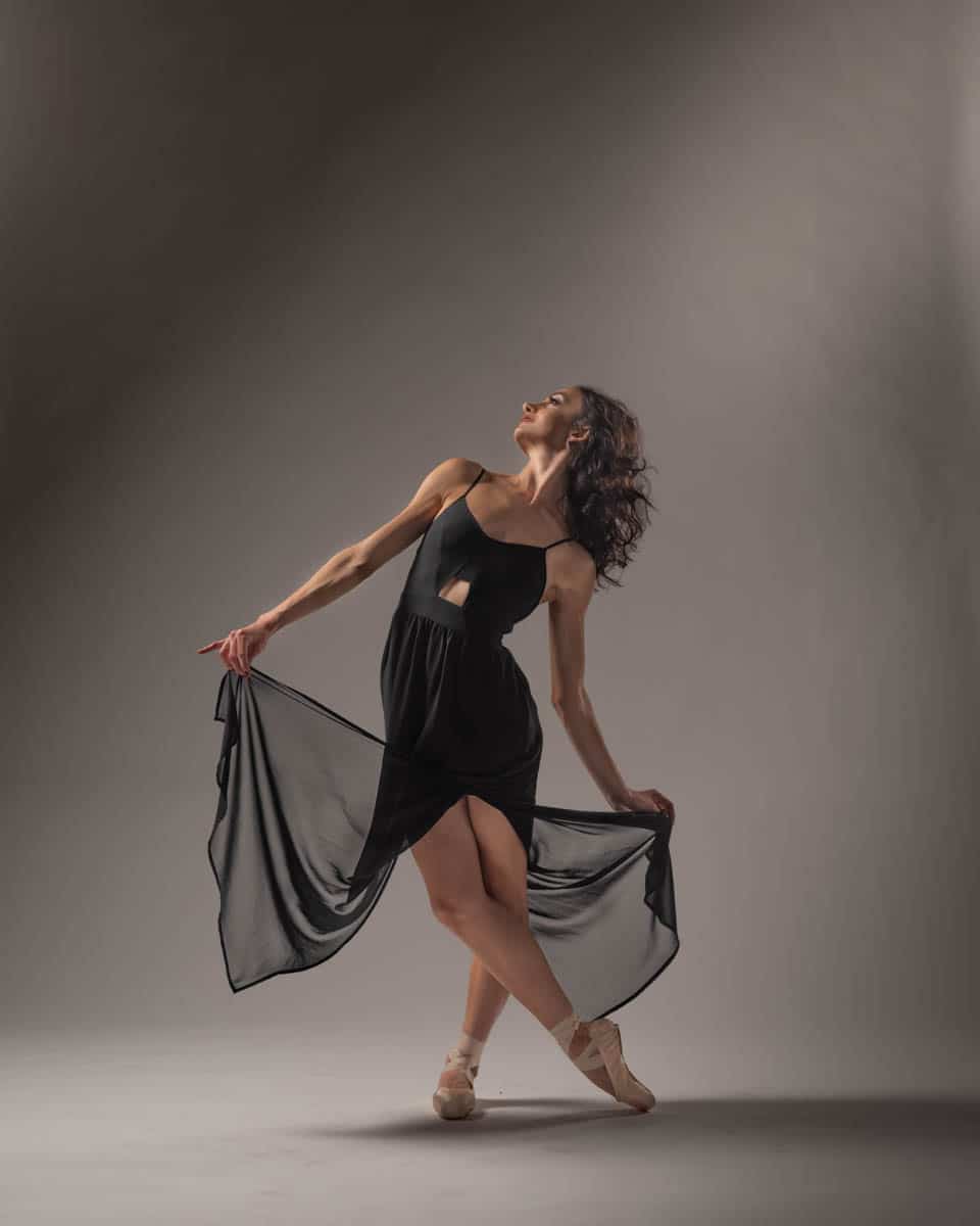 dancer holding black dress