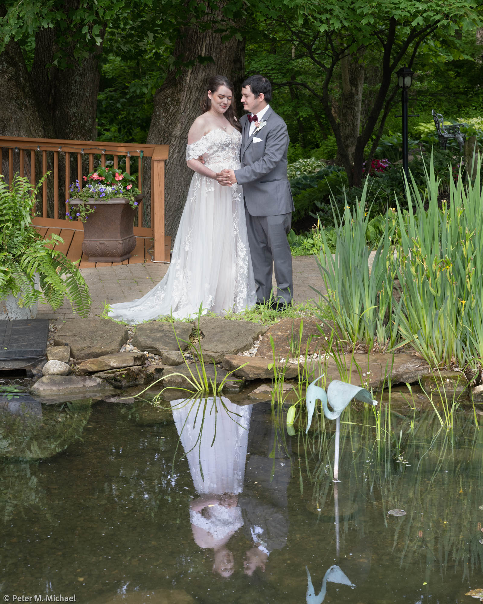 bride groom reflected in pond