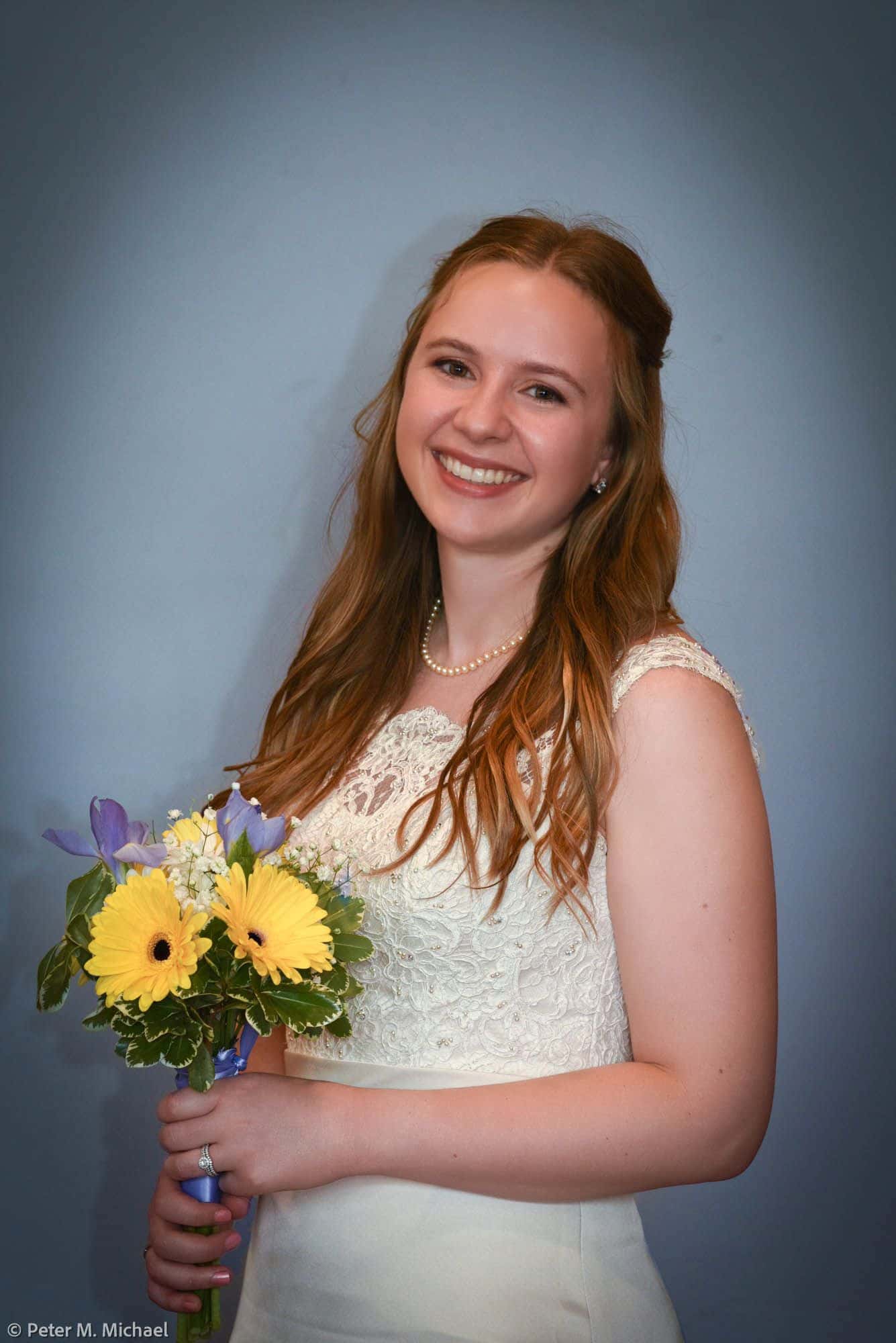 studio bridal portrait with bouquet