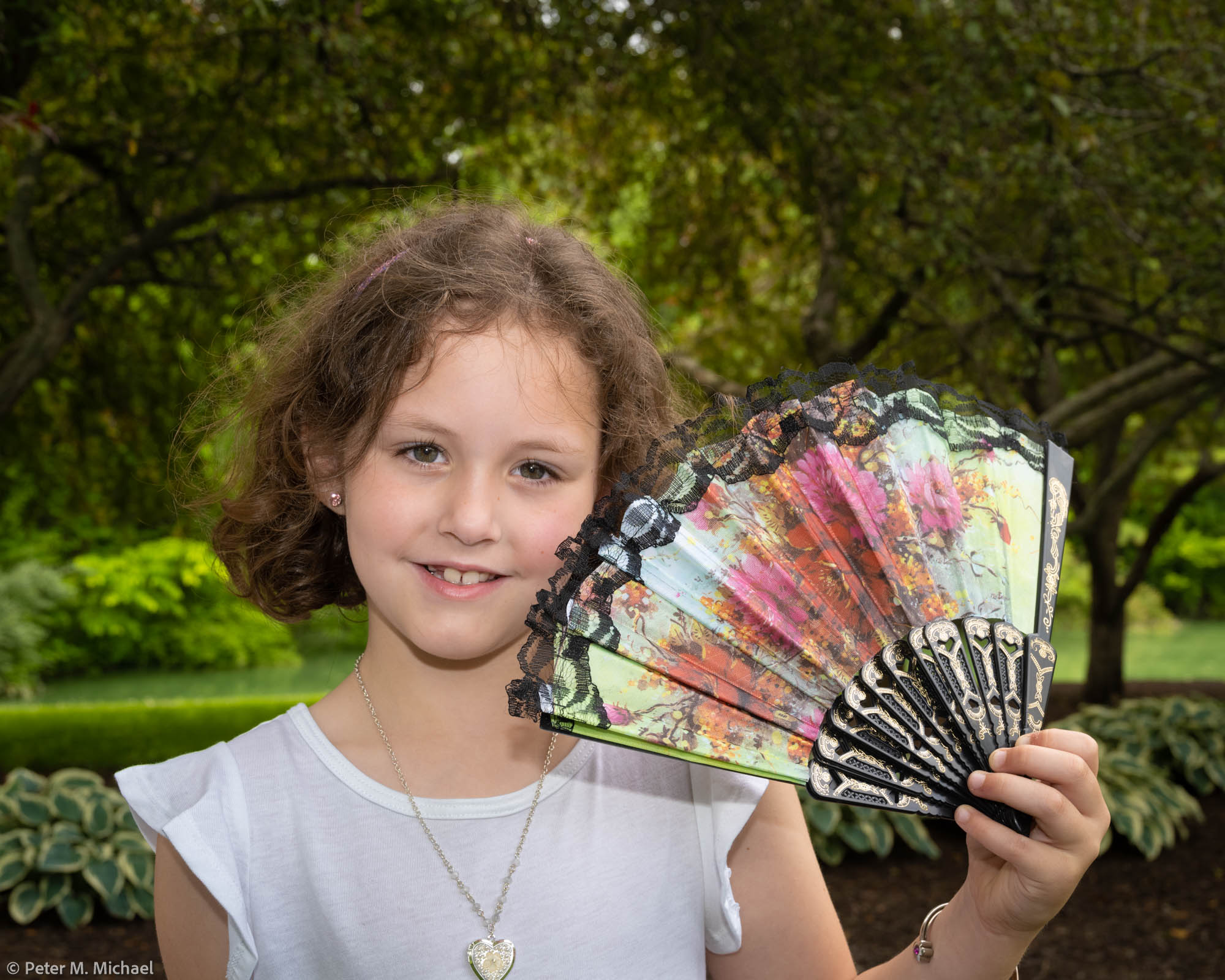 young wedding guest with fan
