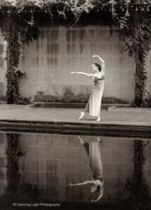 Ballet dancer with her reflection in the In the still water of the Indianapolis canal