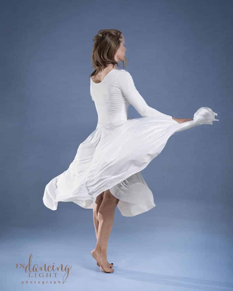 Ballet dancer twirls n a white dress