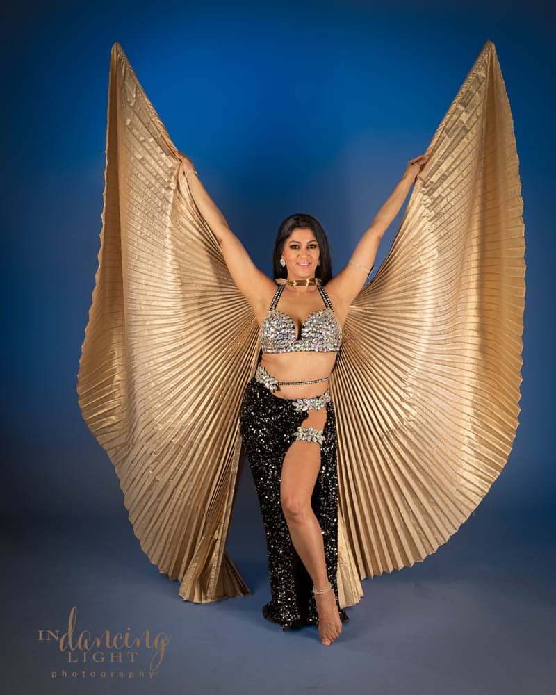 Mediterranean belly dancer with pleated fabric wings