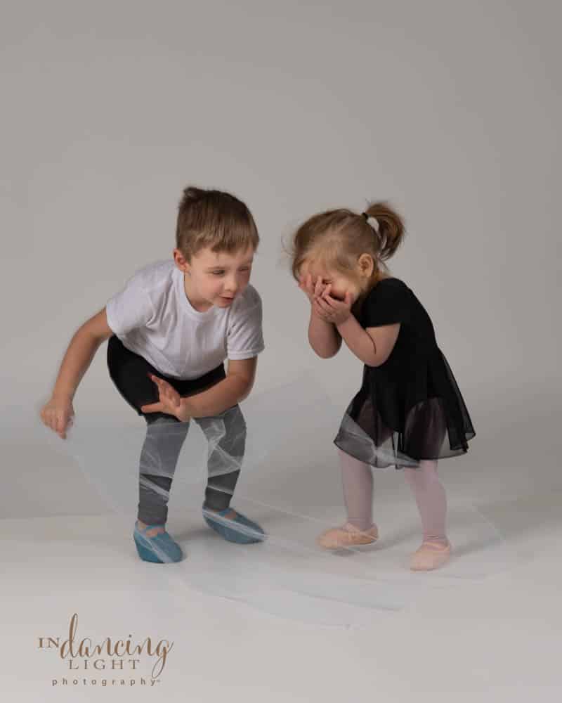 Two young children try to dance