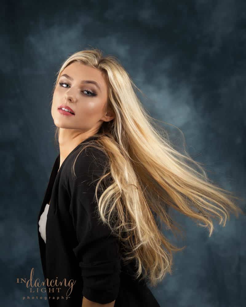Glamor portrait of a young woman with long flowing hair