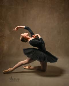 Ballet dancer in a tutu gazing upwards